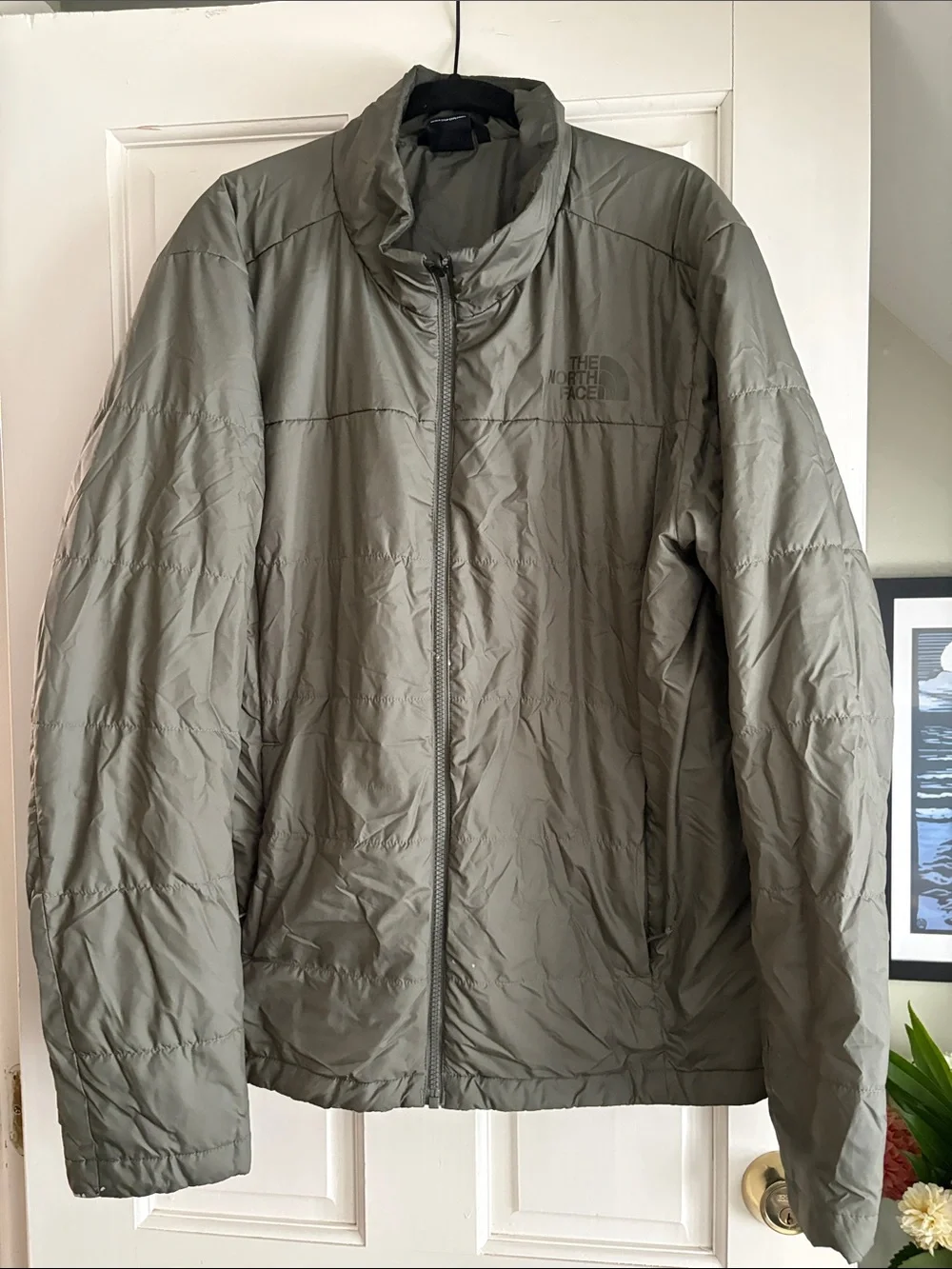 The North Face Men's Puffer Jacket - Olive Green light weight.